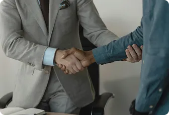 Two professionals shaking hands as a greeting